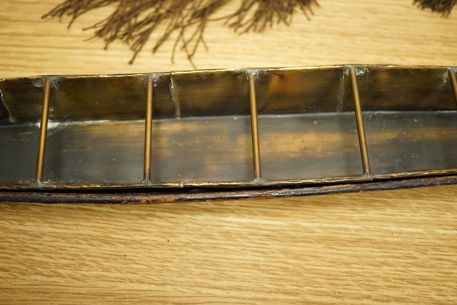 A Chinese export lacquer model of a boat, 19th century, 56cm wide